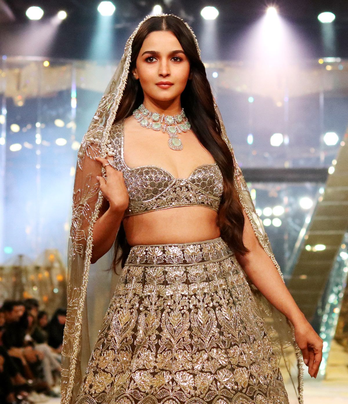 Alia Bhatt looked like an absolute diva in a golden designer lehenga at a  wedding event in Mumbai. The shimmering skirt is only made better with the  studded cho…