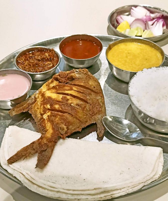 A fish thali with soulkadhi