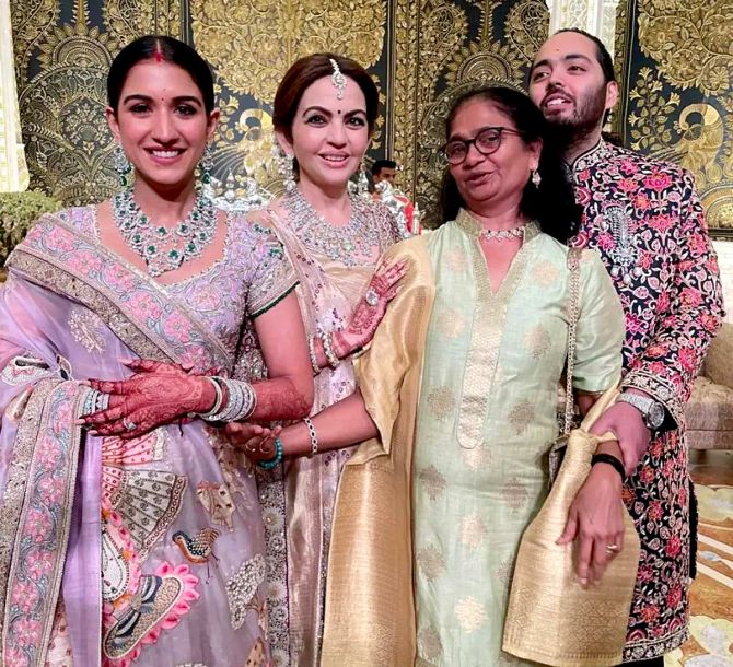 Lalita with the newly-weds, Radhika and Anant, and Nita Ambani