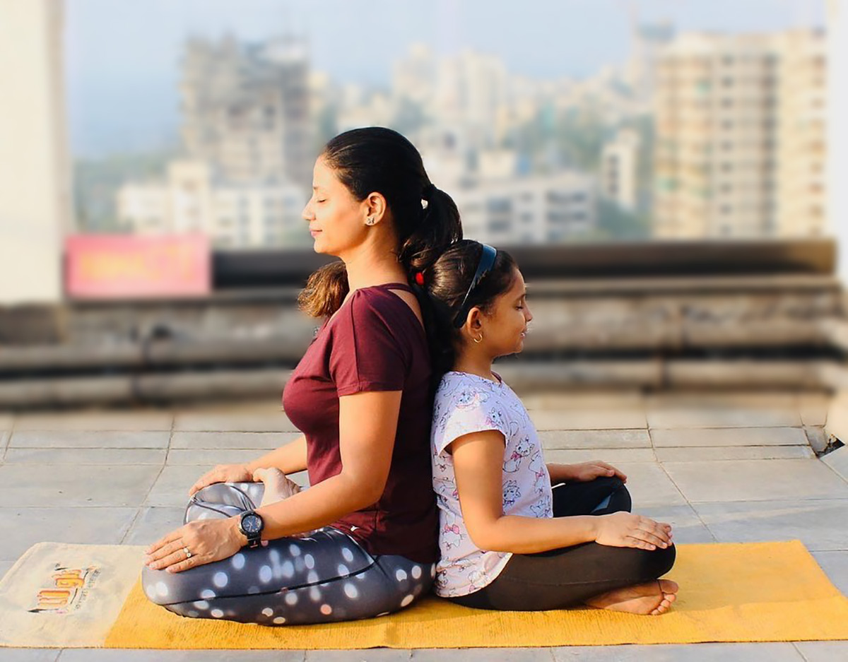 Yoga asanas to do with kids in the monsoon