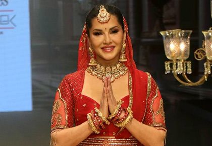 Sunny Leone in a red bridal lehenga walking for Sonali Jain at Bombay Times Fashion Week 2024 Mumbai