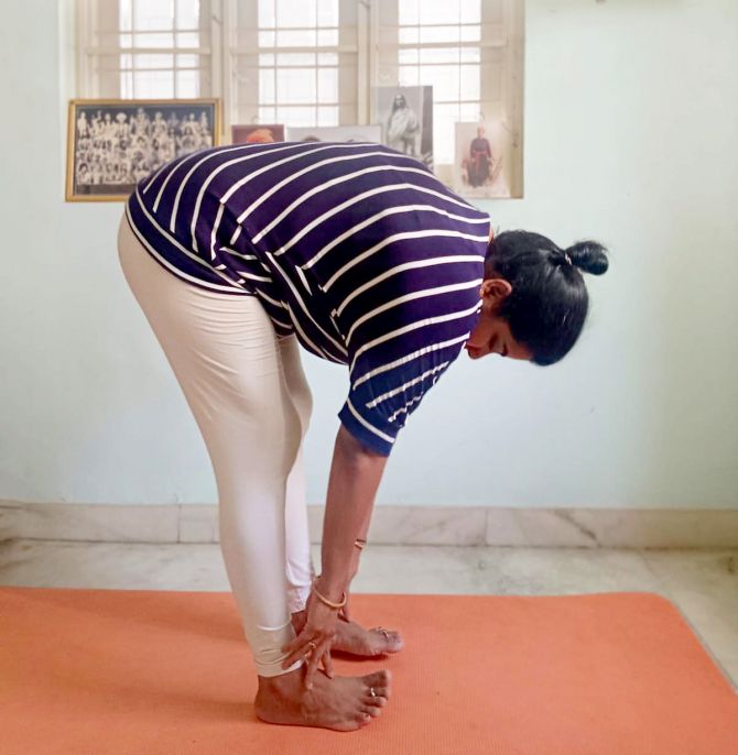 Padahasthasana (hand to foot pose)