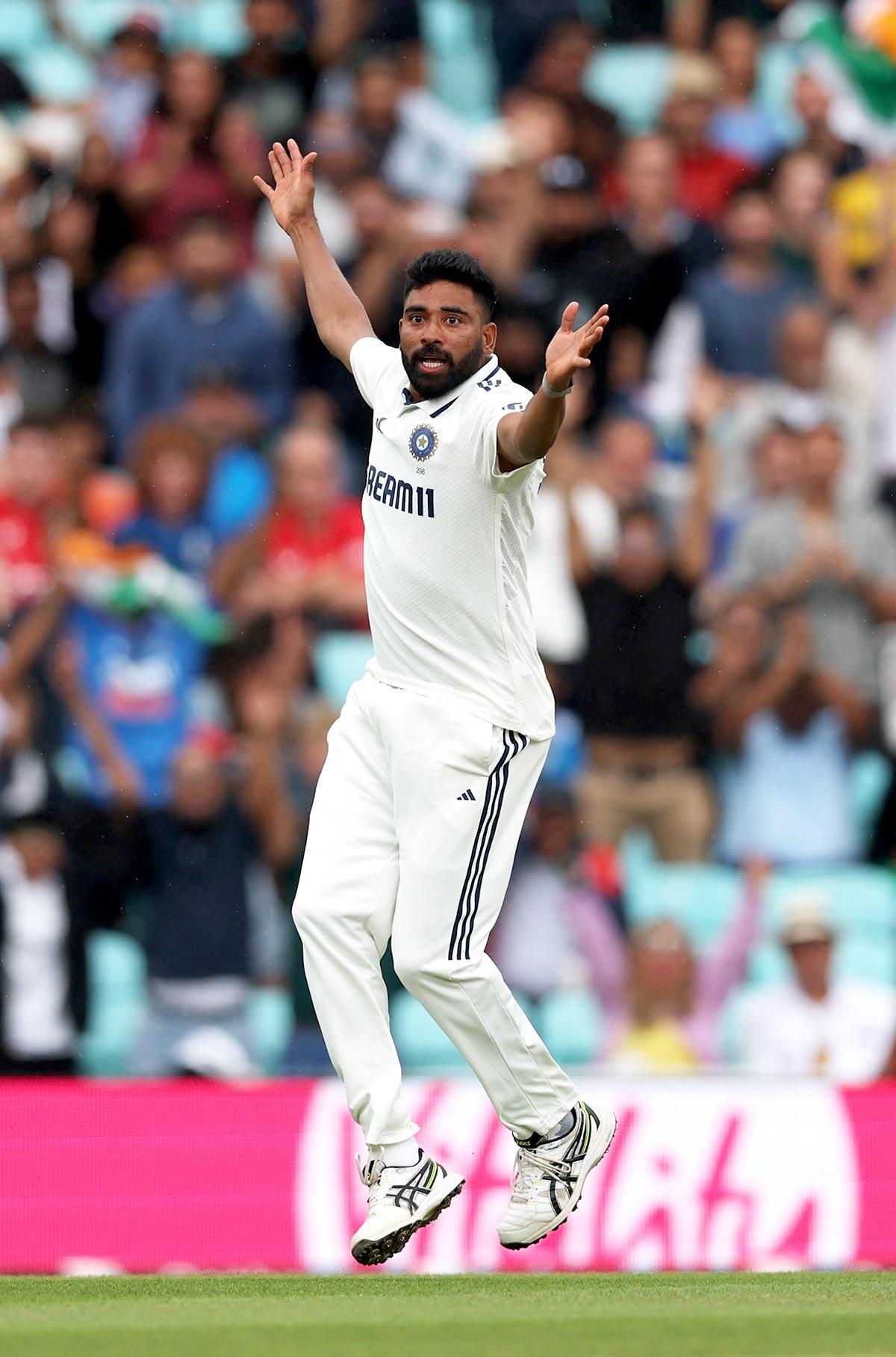 Mohammed Siraj celebrates taking the wicket of England's Jamie Smith Action