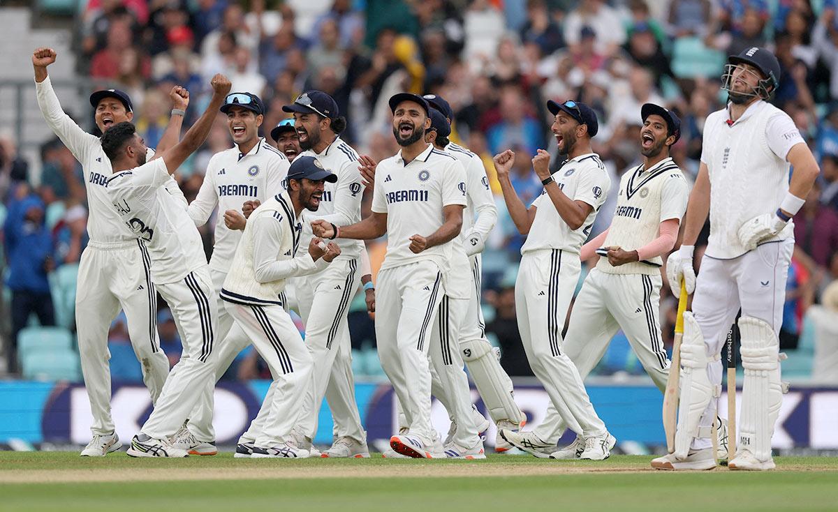 Mohammed Siraj celebrates taking the wicket of England's Jamie Overton with teammates 
