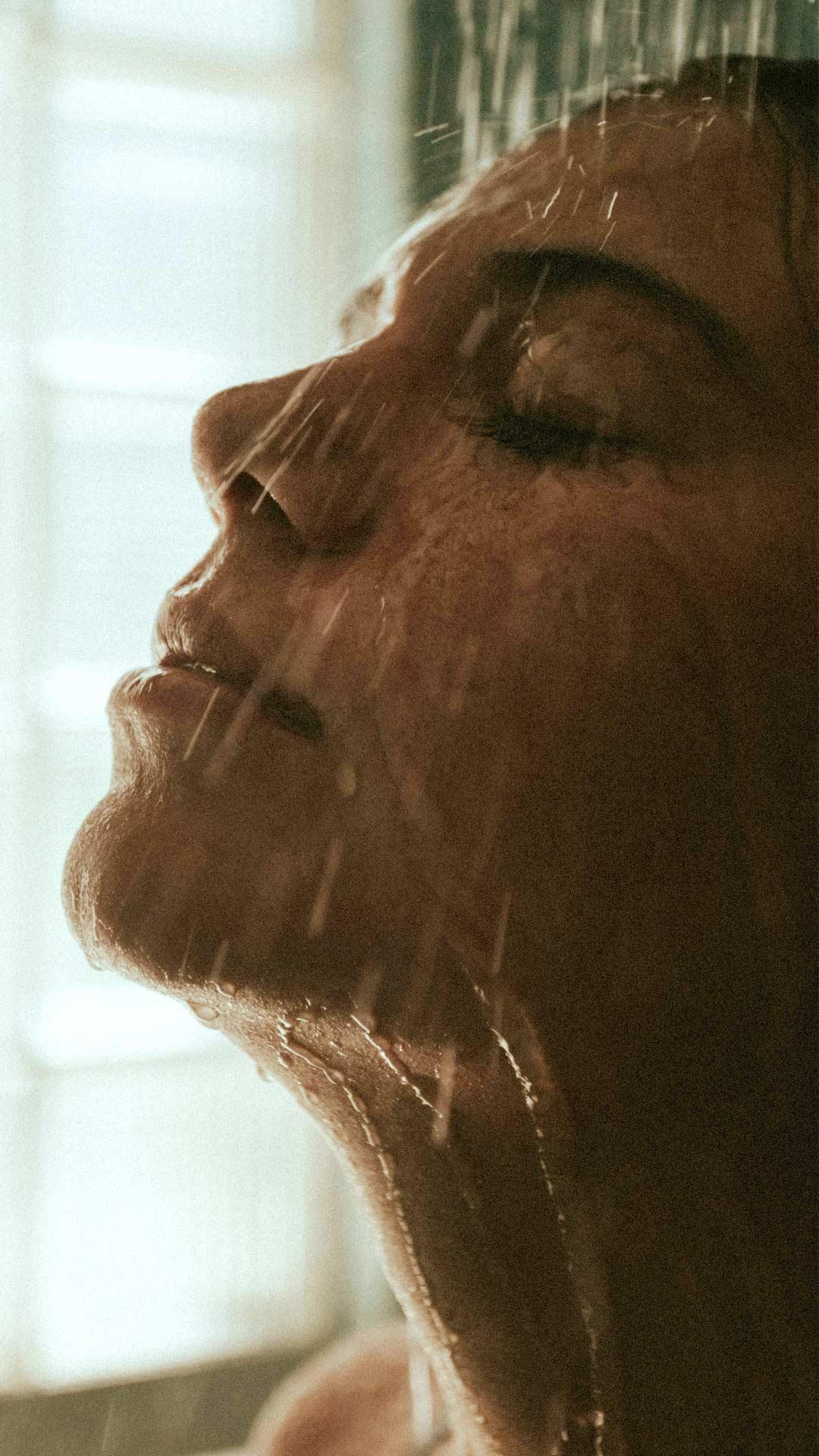 Close-Up Shot of a Person Taking a Shower