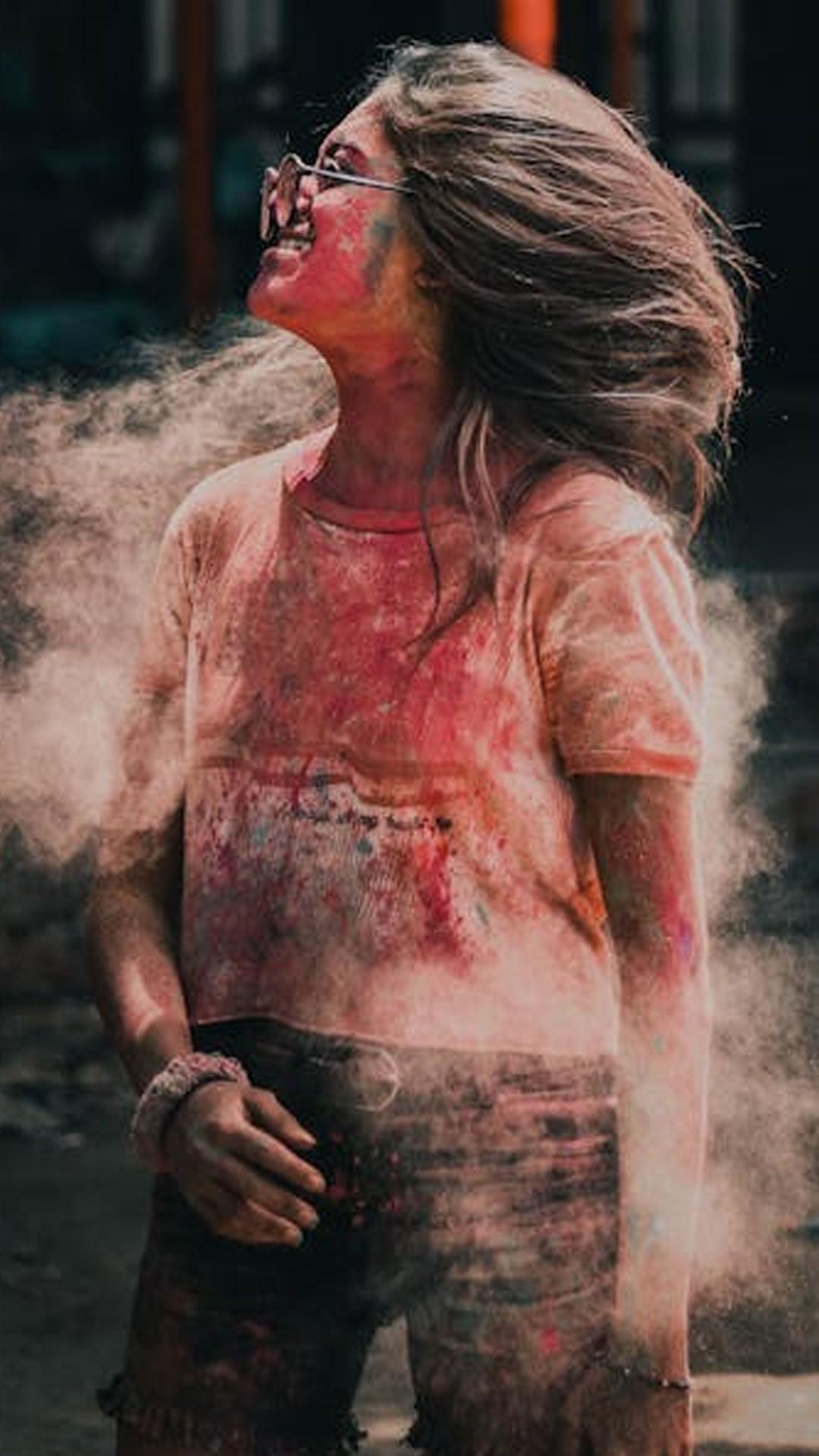 Close-Up Shot of a Woman Covered in Holi Powder