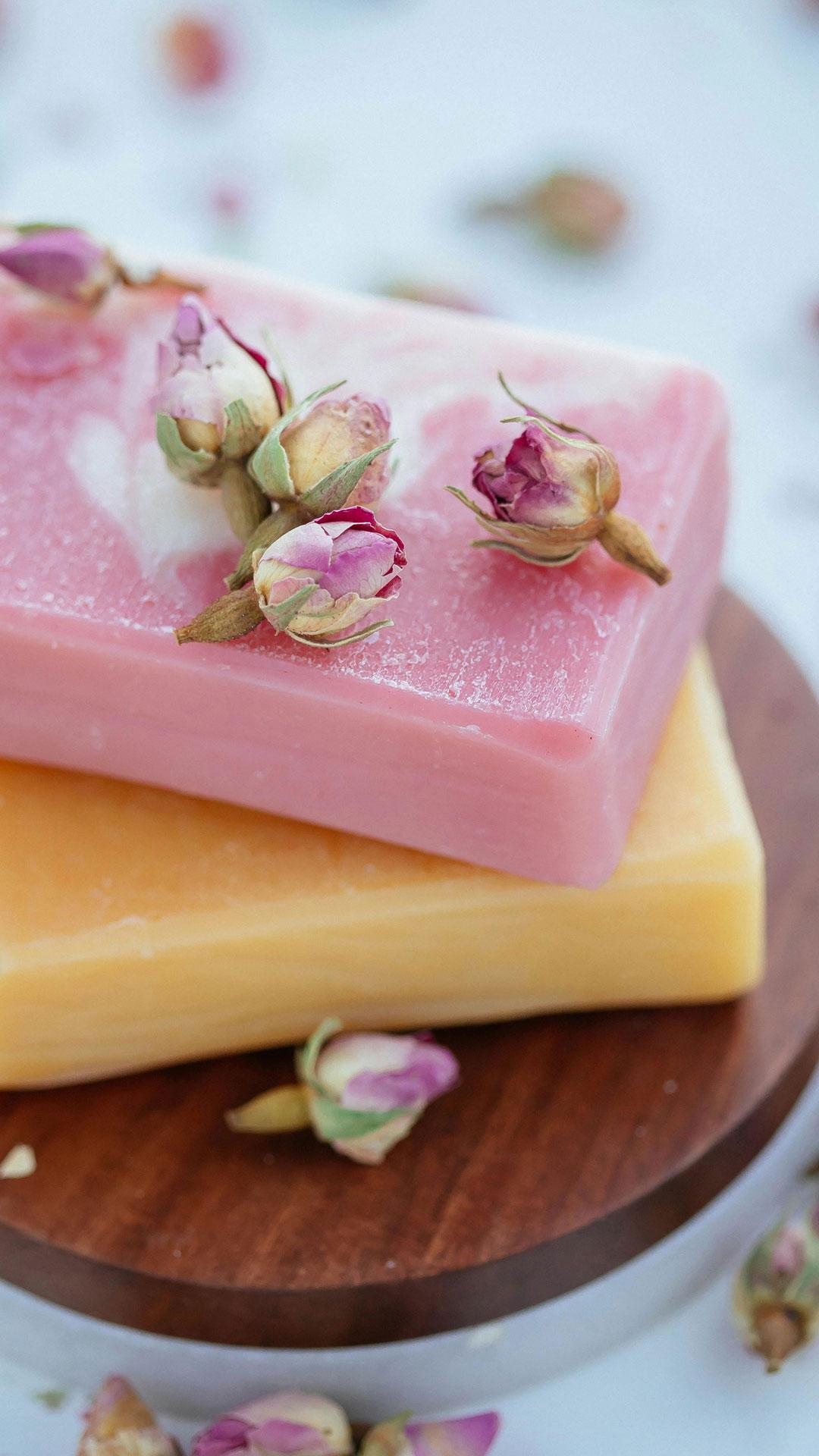 Close-up View of Bars of Soap and Flowers