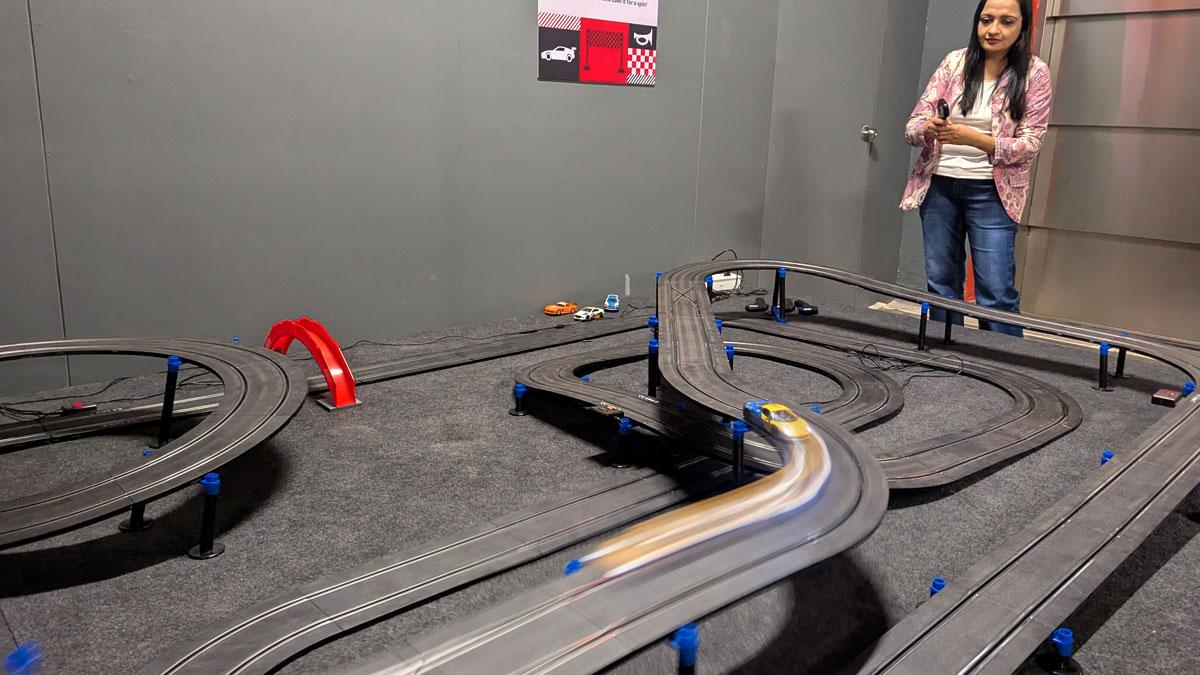 You get to race cars at Vroom