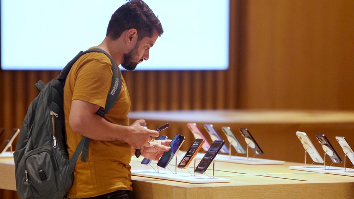 A boy checks the newly launched iPhone 17 at the Apple Store A boy checks the newly launched iPhone 17 at the Apple Store