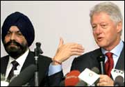 Former US President Bill Clinton addreses the press as Chief Executive Officer of Ranbaxy Labotaries Ltd D.S. Brar (L) looks on in New Delhi on Friday. Photo: Prakash Singh/AFP/Getty Image