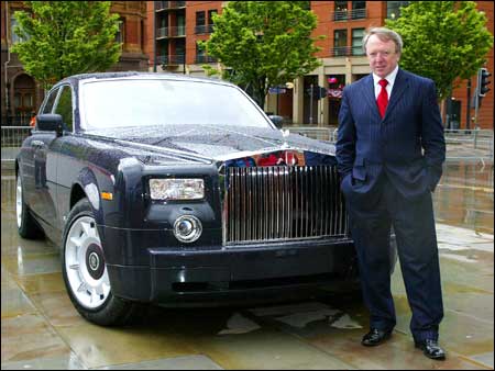 Rolls-Royce Chairman Tony Gott poses with the new, ultra-exclusive Centenary Phantom. Photo: Steve Parkin/AFP/Getty Images