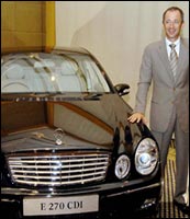 Daimler-Chrysler India CEO Hans Michael Huber with the newly launched Mercedes Benz E270 CDI. Photo: Prakash Singh/AFP/Getty Images