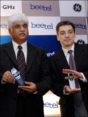 Rakesh Bharti Mittal (L), vice chairman and managing director of Bharti Teletech, and Nicolas Zentz, head of sales for Atlinks Worldwide, display the newly launched 2.4 GHz band cordless phone range in New Delhi on Tuesday.  Photo: Raveendran/AFP/Getty Images