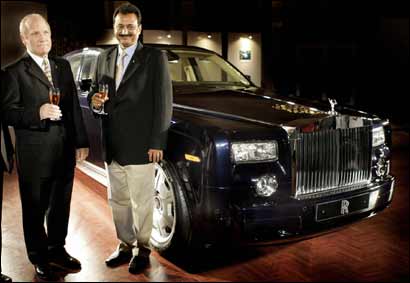 Regional director of Asia-Pacific Rolls-Royce Motor Cars, Colin Kelly (L) poses with the newly launched Rolls-Royce Phantom as an Indian franchisee joins him in New Delhi. Photograph: Prakash Singh/AFP/Getty Images