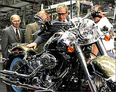 US President George W Bush at the Harley-Davidson assembly plant in York, Pennsylvania, along with Jim Ziemer (L), President and CEO of Harley-Davidson, Inc. Photograph: Tim Sloan / AFP / Getty Images