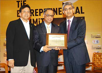 N R Narayan Murthy, co-founder and chairman of the board, Infosys Technologies, gets TiE Entrepreneurship Award from Apurv Bagri (right), chairman, TiE Global, and Shridhar Iyengar (left), president, TiE Global.