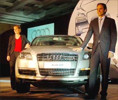 Audi executive director Andre Konsbruk (right) and product manager Sandra Berger pose with Audi Q7 sports utility vehicle unveiled in New Delhi on Friday. The SUV costs Rs 61 lakh. Photograph: Dijeshwar Singh/ Saab Pictures
