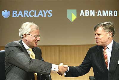 Head of Barclays John Varley (left) with ABN Amro CEO Rijkman Groenink (right) before a press conference at ABN Amro headquarters in Amsterdam. Barclays has agreed to buy rival ABN Amro for $91.16 billion. Photograph: Marcel Antonisse/AFP/Getty Images