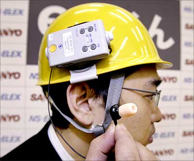e-Mimi kun, developed by NS-ELEX Co, works like a microphone and an earpiece by detecting air vibrations inside the ear. Photograph: Yoshikazu Tsuno/AFP/Getty Images