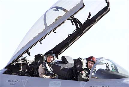 Tata Group chairman Ratan Tata (L) and US pilot Todd Nelson sit in the cockpit of a US made F-18 aircraft ahead of a flight during the third day of the Aero India 2007 air show at the Air Force Station, Yelahanka, in Bangalore, on Friday. Photograph: Dibyangshu Sarkar/AFP/Getty Images