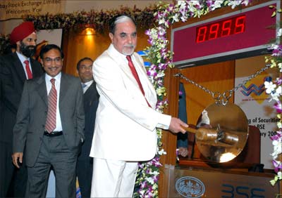 Zee Group's demerged firms Zee News and Wire and Wireless (India) Ltd were listed on the BSE on Wednesday. Zee chairman Subhash Chandra (right) rang the opening bell at the Bombay Stock Exchange. Also seen are (from left) Laxmi Narayan Goel, director, Zee News Group, and Rajnikant Patel, president, BSE. Photograph: Arun Patil