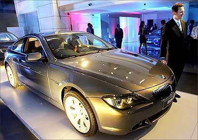 BMW India president Peter Kronschnabl stands next to a BMW 650i car. BMW has set up a plant in Chennai and started manufacturing 3 series and 5 series cars. Photograph: Dibyangshu Sarkar/AFP/Getty Images