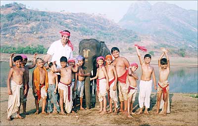 Ashwin K Verma, corporate vice president and chief marketing officer, New York Life's Cultural Markets and director of the commercial, posing with the children who acted in the TV advertisement along with the elephant, Devnarayan.