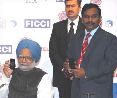 Prime Minister Manmohan Singh inaugurating MTNL's 3G services on Thursday in New Delhi. Minister for Communications & IT A Raja was also present. The country's first video call was enabled by Motorola's 3G network and Motorola's MOTORAZR2 V9 Ferrari Special Edition mobile phone. | Photograph, courtesy: MTNL
