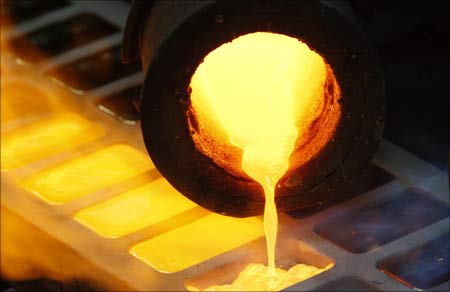 Melted gold flows out of a smelter into a mould at a plant of gold refiner in Istanbul, Turkey.
