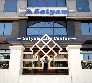 An employee of Satyam Computer Services enters the office in Hyderabad.