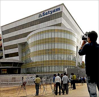 A news cameraman films outside the headquarters of Satyam Computer Services.