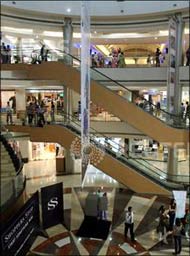 Image: People stroll a mall in Mumbai. Photograph: Punit Paranjpe/Reuters 
