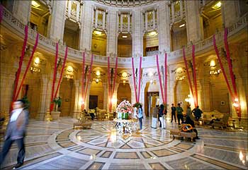 Guests walk through the lobby of Umaid Bhawan Palace, a five-star deluxe hotel, in Jodhpur.