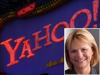 A Yahoo! sign is seen in New York's Times Square. (Inset) Yahoo CEO Carol Bartz.