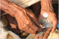 An old man counting his money