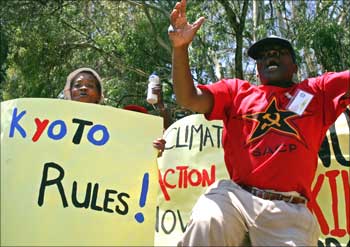 People demonstrate against the US refusal to ratify the Koyoto protocol outside US consulate in Johannesburg, South Africa.