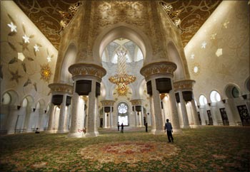 Muslims walk inside Sheikh Zayed mosque in Abu Dhabi.