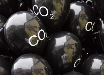 Protesters reflected in balloons as they demonstrate against CO2 emissions in Kiev.