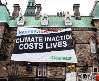 A Greenpeace banner on climate inaction.