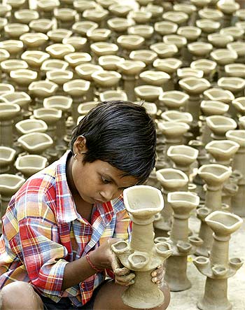 An artisan makes earthen lamps at a workshop ahead of the Hindu festival of Diwali in Amritsar.