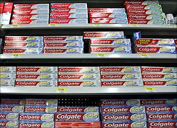Boxes of Colgate toothpaste are displayed on store shelves in Westminster.