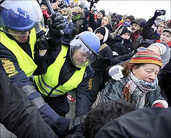 Police clash with protesters at a roadblock near the venue of the United Nations Climate Change Conference 2009 in Copenhagen.