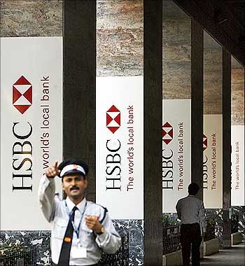 A security man gestures in front of the head office of HSBC bank in Mumbai.
