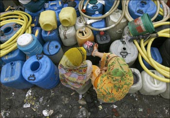 Women waiting for a water tanker in a Mumbai suburb.