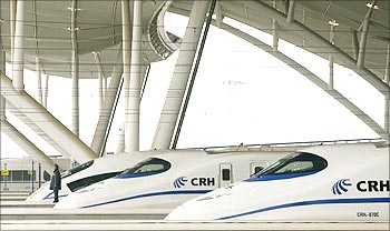 A security guard stands beside China Railway High-speed (CRH) trains preparing to leave for Guangzhou in Wuhan.