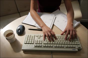 A woman working at her desk.