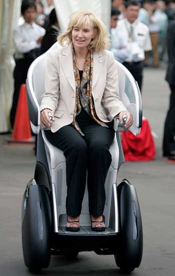 Canadian PM Stephen Harper's wife Laureen rides a Toyota Motor Corp i-REAL concept vehicle.