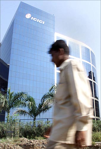 A man walks past the ICICI headquarters in Mumbai.