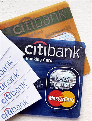 Citibank regular and gold bank cards, along with several ATM receipts, are seen in this photo illustration taken in New York.