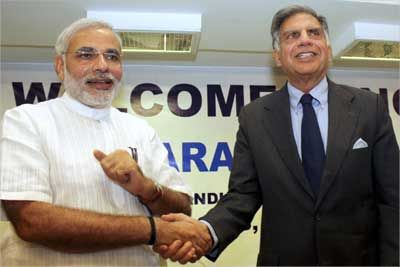 Tata Group Chairman Ratan Tata (R) shakes hands with Gujarat's Chief Minister Narendra Modi in Ahmedabad.